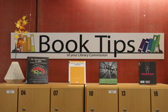 Book Tips sign above books on the lockers.